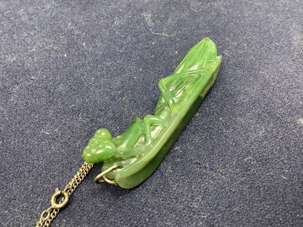 A Chinese jadeite pendant , a pair of bangles, earrings and a cricket pendant